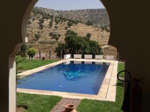 a swimming pool with a view of a mountain at Riad Asmaa Agadir in Agadir