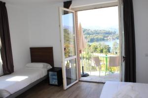 Postel nebo postele na pokoji v ubytování Hotel Bocciolo + 37 fotografií