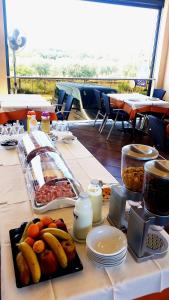 a table with a buffet of food on it at Rooms Edda in Umag