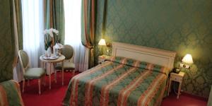 Postel nebo postele na pokoji v ubytování Hotel Villa Delle Palme