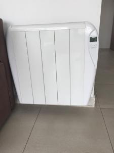 a white refrigerator with its door open in a room at First line Apartment in Alicante
