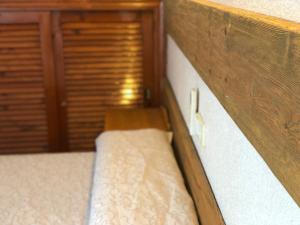 A bed or beds in a room at El Colorín