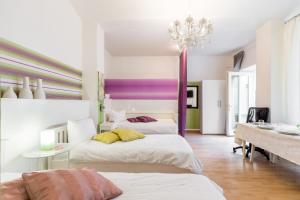 Ein Bett oder Betten in einem Zimmer der Unterkunft Modernes 2-Zimmer-Apartment in Kollwitzplatz-Nähe