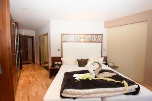 Postel nebo postele na pokoji v ubytování Hotel Jennys Schlössl