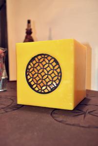 a yellow box sitting on top of a table at Riad Essaada in Marrakech