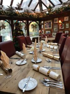 a long wooden table with plates and napkins on it at The Exhibition in York