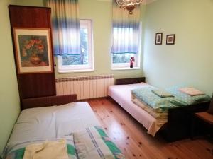 Łóżko lub łóżka w pokoju w obiekcie Pokoje Gościnne Lalaj
