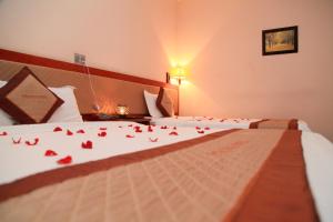 Postel nebo postele na pokoji v ubytování Paradis Hotel