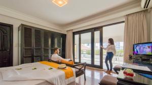 TV a/nebo společenská místnost v ubytování White Mansion 白色公馆