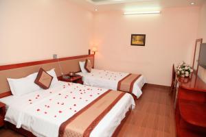Postel nebo postele na pokoji v ubytování Paradis Hotel
