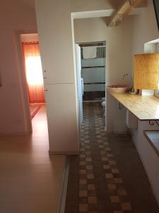 Kuchyň nebo kuchyňský kout v ubytování Il Cortiletto