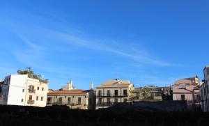 a group of buildings with a blue sky in the background at Ai Carrettieri della Cattedrale in Palermo