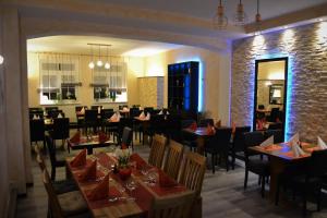 a restaurant with tables and chairs and a brick wall at B&B Mediterran Nassau in Nassau