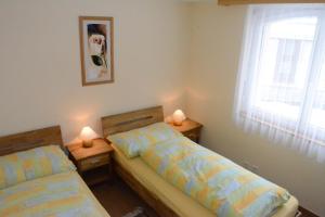 Postel nebo postele na pokoji v ubytování Haus Orta