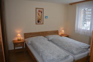 Postel nebo postele na pokoji v ubytování Haus Orta