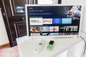 TV a/nebo společenská místnost v ubytování Vivienda Vacacional Casetta Volante