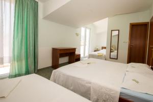Letto o letti in una camera di Bed and Breakfast Helena