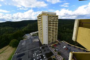 an aerial view of a tall building in the mountains at Jasmin in Hohegeiß