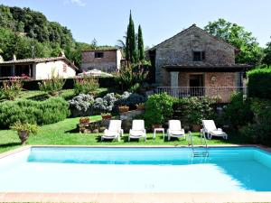 a swimming pool in front of a house at Villa Stefano in Dicomano