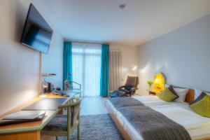 Postel nebo postele na pokoji v ubytování Paulin Hotel Trier