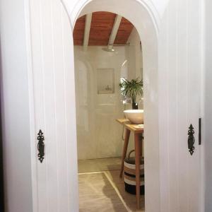 a bathroom with a sink and a white sink at Quinta da Lua in Tavira