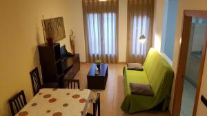 Cama o camas de una habitación en Apartamentos Puerta Muralla