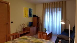 Cama o camas de una habitación en Apartamentos Puerta Muralla