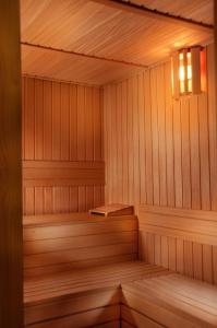 a small wooden sauna with a light in it at Pazo Los Escudos Hotel Spa & Resort in Vigo