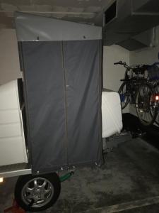 a tent in a garage with a bike in it at Cala Azul 304-306 Tamarit in Tamarit
