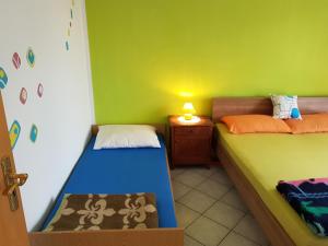 En eller flere senger på et rom på Apartment Kunčić