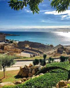 a view of an amphitheater with the ocean in the background at Cala Azul 304-306 Tamarit in Tamarit