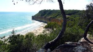 a group of people on a beach near the ocean at Cala Azul 304-306 Tamarit in Tamarit