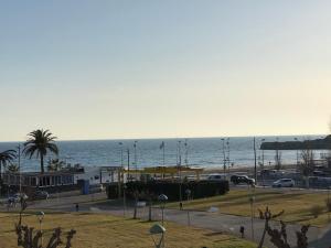 a view of a beach with the ocean in the background at Cala Azul 304-306 Tamarit in Tamarit