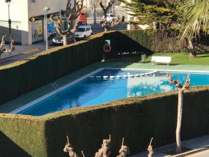a swimming pool in the middle of a street at Cala Azul 304-306 Tamarit in Tamarit