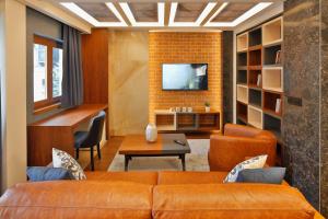 TV a/nebo společenská místnost v ubytování Hotel Passpartù Home Garni