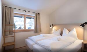 Posteľ alebo postele v izbe v ubytovaní Kitzbuheler Alpen Penthouse Hollersbach