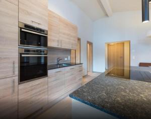 Kuchyňa alebo kuchynka v ubytovaní Kitzbuheler Alpen Penthouse Hollersbach