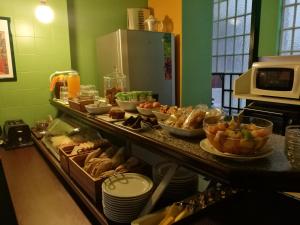 a buffet of food on a counter in a kitchen at Hotel Leiria Classic in Leiria