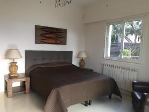Un pat sau paturi într-o cameră la Villa Soley