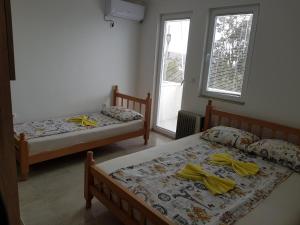 Katil atau katil-katil dalam bilik di Apartmani Vila Ebra