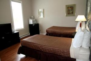 Postel nebo postele na pokoji v ubytování Hotel Squamish