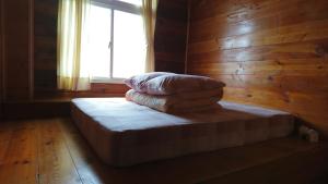 Postel nebo postele na pokoji v ubytování An Yun Mountain Homestay