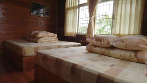 Postel nebo postele na pokoji v ubytování An Yun Mountain Homestay