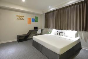 Postel nebo postele na pokoji v ubytování Taichung Box Design Hotels