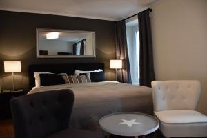 Postel nebo postele na pokoji v ubytování Boutique-Hotel Antica Posta