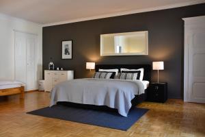 Postel nebo postele na pokoji v ubytování Boutique-Hotel Antica Posta