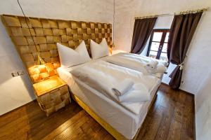 Postel nebo postele na pokoji v ubytování Arcadie Hotel & Apartments