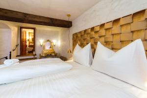 Postel nebo postele na pokoji v ubytování Arcadie Hotel & Apartments