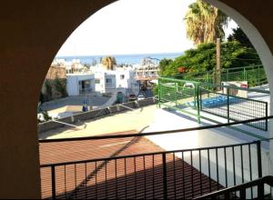 a balcony with a view of a swimming pool at Sunny Napa Apartments in Ayia Napa