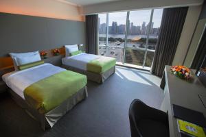 72 Hotel Sharjah客房内的一张或多张床位